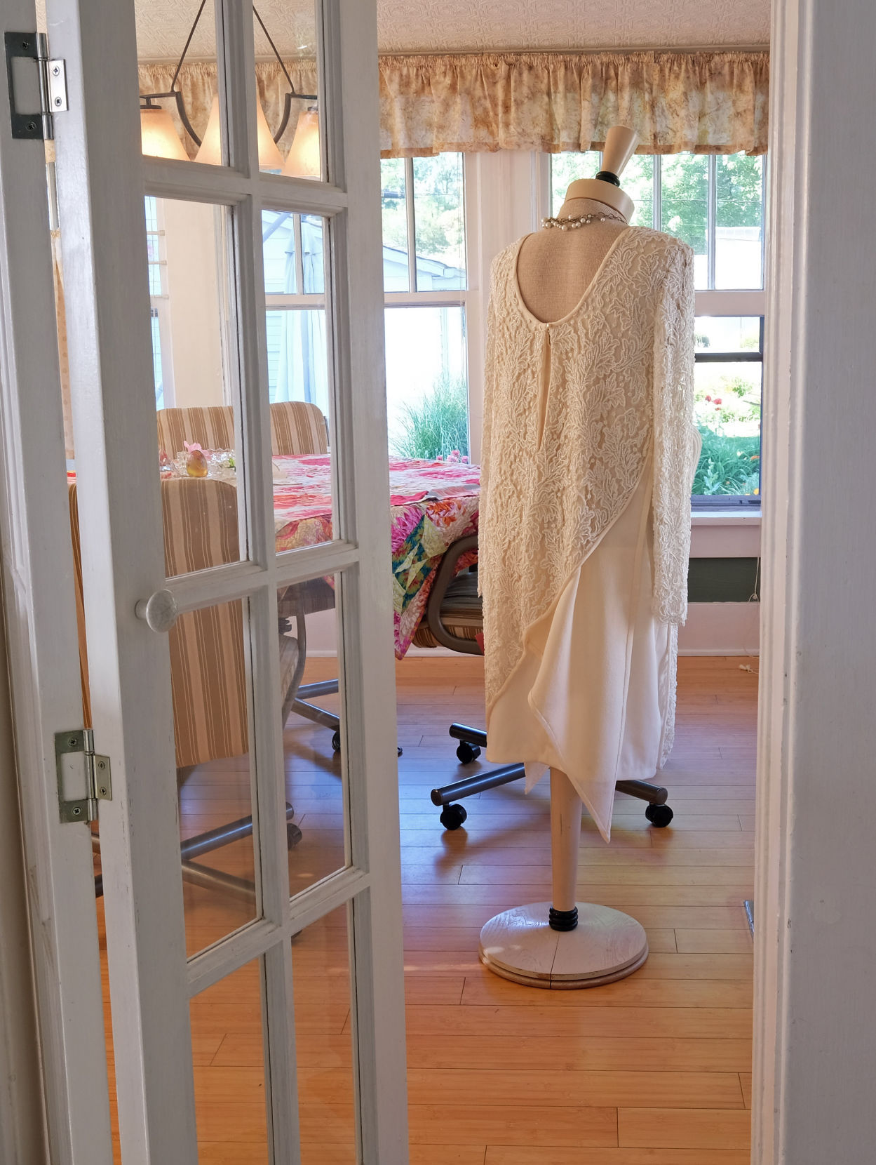 The soft buzz of a lawnmower a few blocks away and birds chirping right outside the open windows is a stark contrast to the stuffy fitting rooms and commercial buildings where clothes are often sold, fitted and altered.